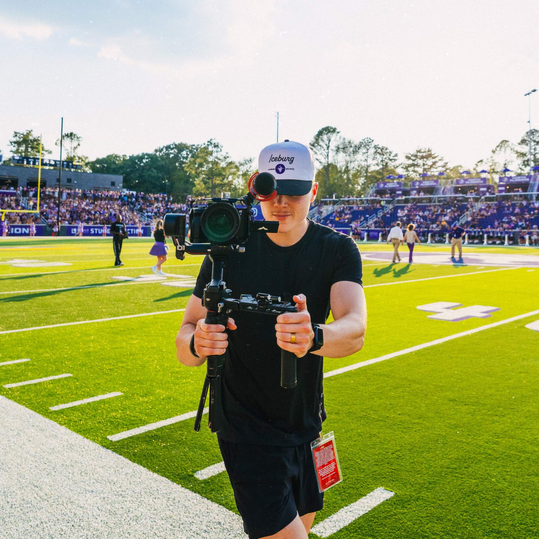 Filming on the sideline at a University of North Alabama football game